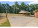 Spacious backyard features a basketball court and carport, ideal for outdoor activities at 229 Campsite Rd, Rock Hill, SC 29732