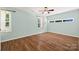 Bright bedroom features hardwood floors, ceiling fan and abundant natural light at 229 Campsite Rd, Rock Hill, SC 29732