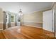 Spacious dining room features hardwood floors, chandelier, and large windows for natural light at 229 Campsite Rd, Rock Hill, SC 29732