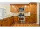 Close-up of the kitchen's stainless steel oven and cooktop at 229 Campsite Rd, Rock Hill, SC 29732