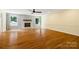 Bright living room features hardwood floors, brick fireplace, and large windows with peaceful views at 229 Campsite Rd, Rock Hill, SC 29732