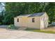 Exterior view of a shed featuring a small ramp and blossoming hydrangeas at 229 Campsite Rd, Rock Hill, SC 29732