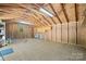 Unfinished shed interior, plywood walls, shelving, work space, and natural light at 229 Campsite Rd, Rock Hill, SC 29732