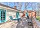 Comfortable backyard deck area with stylish turquoise painted doors at 251 Gleneagles E Rd, Statesville, NC 28625