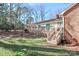 Backyard deck, with a staircase leading down to the lush, grassy lawn at 251 Gleneagles E Rd, Statesville, NC 28625