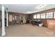 Large, versatile basement space with paneled walls and ample storage options at 251 Gleneagles E Rd, Statesville, NC 28625