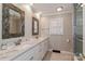 Stylish bathroom with double sinks, marble countertops, and modern fixtures at 251 Gleneagles E Rd, Statesville, NC 28625