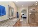 Bright bathroom with granite countertops, walk-in shower, and plenty of natural light at 251 Gleneagles E Rd, Statesville, NC 28625