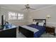 Cozy bedroom with a ceiling fan, natural light, and a comfortable bed at 251 Gleneagles E Rd, Statesville, NC 28625