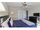 Relaxing bedroom featuring neutral walls, a ceiling fan and an ample closet at 251 Gleneagles E Rd, Statesville, NC 28625