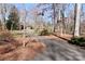 A long driveway leading to the residence, surrounded by lush trees and landscaping at 251 Gleneagles E Rd, Statesville, NC 28625