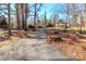 Long driveway with lush landscaping and mature trees, offering a private entrance to the property at 251 Gleneagles E Rd, Statesville, NC 28625