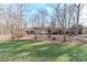 Charming ranch style home with brick accents and a long, private driveway surrounded by mature trees at 251 Gleneagles E Rd, Statesville, NC 28625