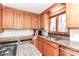 Bright kitchen featuring stainless steel appliances, wood cabinets, and granite counters at 251 Gleneagles E Rd, Statesville, NC 28625
