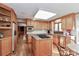 Spacious kitchen featuring stainless steel appliances, wooden cabinetry, and center island with cooktop at 251 Gleneagles E Rd, Statesville, NC 28625