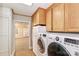 Efficient laundry area with front loading washer and dryer, and overhead cabinets at 251 Gleneagles E Rd, Statesville, NC 28625