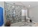 Modern shower with gray tile, multiple shower heads, and a built-in bench at 251 Gleneagles E Rd, Statesville, NC 28625