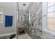 Modern shower with gray tile, multiple shower heads, and a built-in bench at 251 Gleneagles E Rd, Statesville, NC 28625