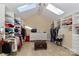 Spacious walk-in closet with skylights, custom shelving, and ample storage space at 251 Gleneagles E Rd, Statesville, NC 28625