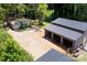Aerial view of sheds, barn and wooded surroundings at 265 St Matthews Church Rd, Salisbury, NC 28146