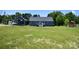 A spacious backyard with the exterior of the house and back deck at 265 St Matthews Church Rd, Salisbury, NC 28146