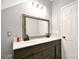 Bathroom vanity with double sinks, modern fixtures and ornate mirror exudes elegance and functionality at 265 St Matthews Church Rd, Salisbury, NC 28146