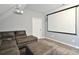 Bonus room with comfortable seating and projector screen creates an ideal home theater setting at 265 St Matthews Church Rd, Salisbury, NC 28146