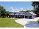 Stunning home featuring a long driveway, beautiful landscaping and a welcoming covered front porch at 265 St Matthews Church Rd, Salisbury, NC 28146