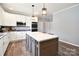 Bright kitchen featuring a center island, stainless steel appliances and wood look flooring at 265 St Matthews Church Rd, Salisbury, NC 28146