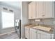 Functional laundry room featuring modern appliances, sink, and storage cabinets for convenience at 265 St Matthews Church Rd, Salisbury, NC 28146