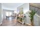 Open-concept living space with wood floors, staircase, and dining area with a view into the kitchen at 265 St Matthews Church Rd, Salisbury, NC 28146