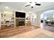 Cozy living room with a decorative fireplace, built-in shelves, and an open layout to dining area at 265 St Matthews Church Rd, Salisbury, NC 28146