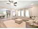 Comfortable living room with a large sectional sofa, a fan, and natural light, and views to other rooms at 265 St Matthews Church Rd, Salisbury, NC 28146