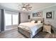 Spacious main bedroom with wood look flooring, window and a decorative ceiling fan at 265 St Matthews Church Rd, Salisbury, NC 28146