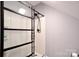 Modern shower features a sleek glass door, contemporary fixtures, and minimalist design at 265 St Matthews Church Rd, Salisbury, NC 28146