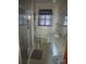 Bathroom with white tile, updated vanity, shower, and a decorative window curtain at 2815 Highland Dr, Lincolnton, NC 28092