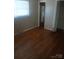Bedroom featuring hardwood floors, floral wallpaper, and natural light at 2815 Highland Dr, Lincolnton, NC 28092