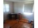 Bedroom with hardwood floors, two windows providing lots of light and neutral walls at 2815 Highland Dr, Lincolnton, NC 28092