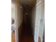 Hallway with hardwood floors, closet, and access to living spaces at 2815 Highland Dr, Lincolnton, NC 28092