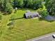 Aerial view of the home featuring a large front yard and mature landscaping at 329 W Red Cross Rd, Oakboro, NC 28129
