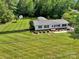 Charming single-story home with meticulously maintained landscaping and a fenced backyard at 329 W Red Cross Rd, Oakboro, NC 28129