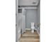Small bathroom features shower with tile surround, white fixtures, and wood look flooring at 329 W Red Cross Rd, Oakboro, NC 28129