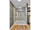 Bright shower featuring a glass door, a built-in seat, and modern fixtures at 329 W Red Cross Rd, Oakboro, NC 28129