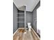 Small bathroom featuring an open shelving unit and wood look floors at 329 W Red Cross Rd, Oakboro, NC 28129