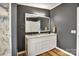 Bathroom with a dual sink vanity, with modern fixtures and hardwood floors at 329 W Red Cross Rd, Oakboro, NC 28129