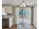 Bright dining area with sliding glass doors leading to outdoor deck at 329 W Red Cross Rd, Oakboro, NC 28129