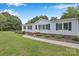 Inviting single-story home featuring a well-manicured lawn and tasteful landscaping at 329 W Red Cross Rd, Oakboro, NC 28129