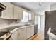 A well-appointed kitchen with ample cabinet space and laminate countertops at 329 W Red Cross Rd, Oakboro, NC 28129