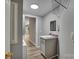 Laundry room including utility sink, overhead lighting, and washer/dryer hookups at 329 W Red Cross Rd, Oakboro, NC 28129