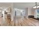 A spacious living area with wood-look floors seamlessly connects the kitchen and dining areas at 329 W Red Cross Rd, Oakboro, NC 28129